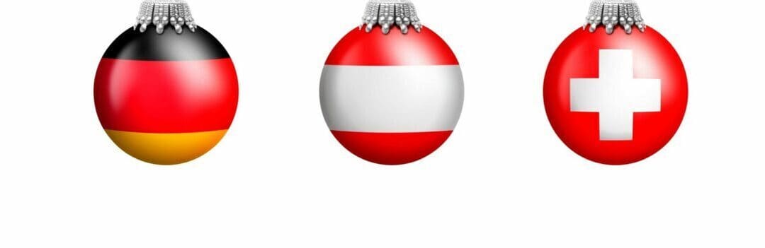 Drei Kugeln mit Fahnen von Deutschland, Österreich, Schweiz. Ihren Texter für den deutschen Sprachraum finden Sie hier!